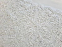 Dentelle ivoire creme bord festonné perles