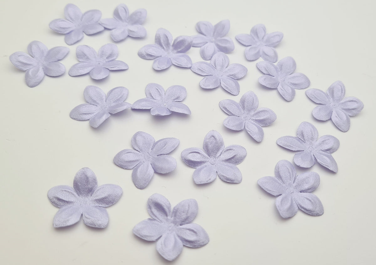 Lot de 50 petites fleurs parme